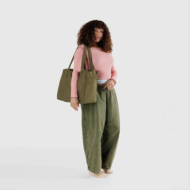 Person holding Seaweed Cloud Carry-on bag