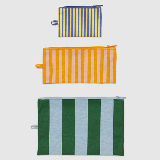 A Set of three Baggu Hotel Stripes Flat pouches laid flat