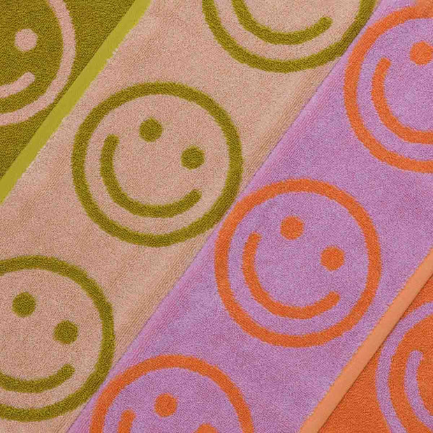 Close up of Baggu Smiley hand Towels in Happy Lilac Ochre Mix