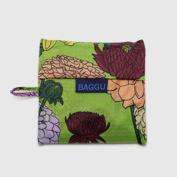 A Standard Baggu reusable bag in the Dahlia design in its pouch