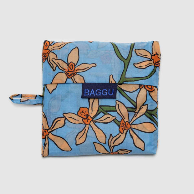 A Standard Baggu reusable bag in the Orchid design in its pouch