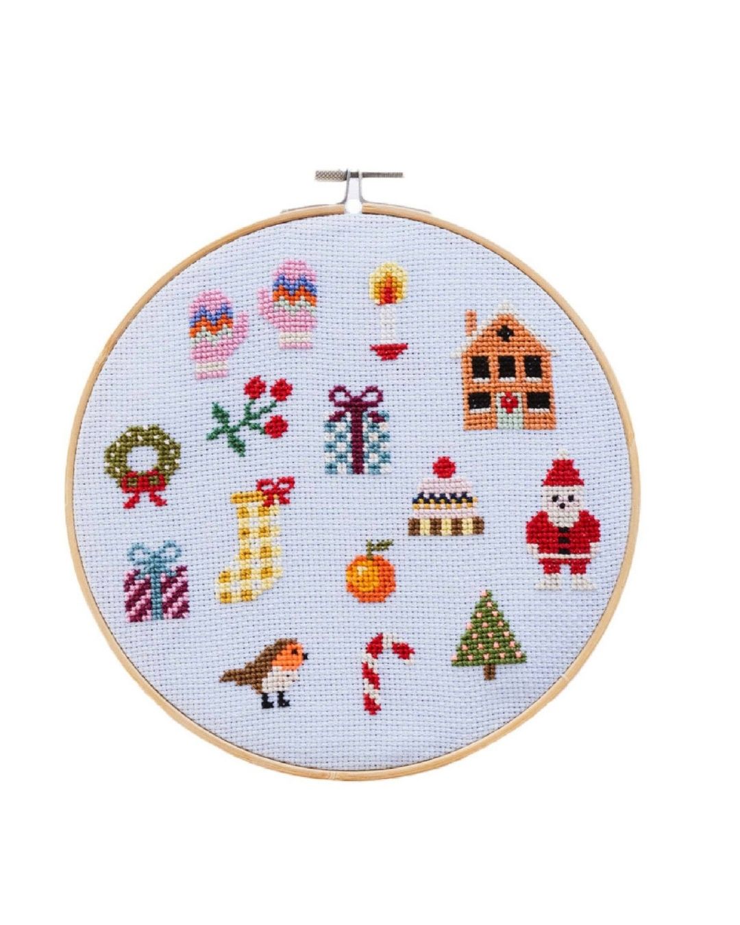 Cotton Clara Christmas-themed cross-stitch kit featuring festive colors and holiday design.