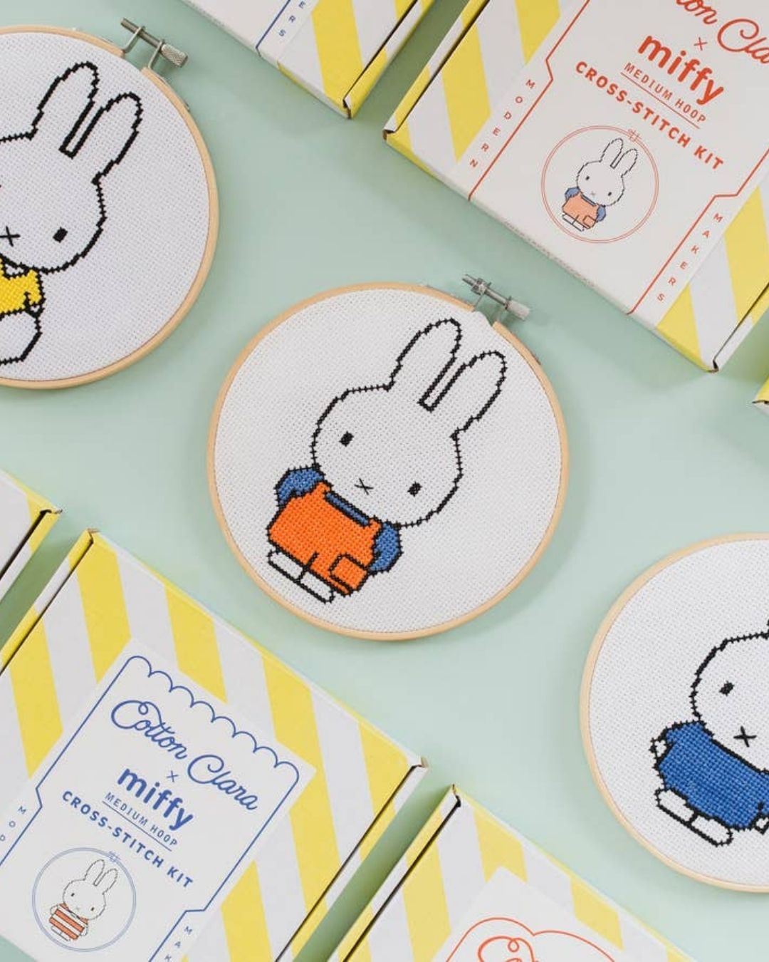 A cross-stitched Miffy bunny in an embroidery hoop, embroidery kit.