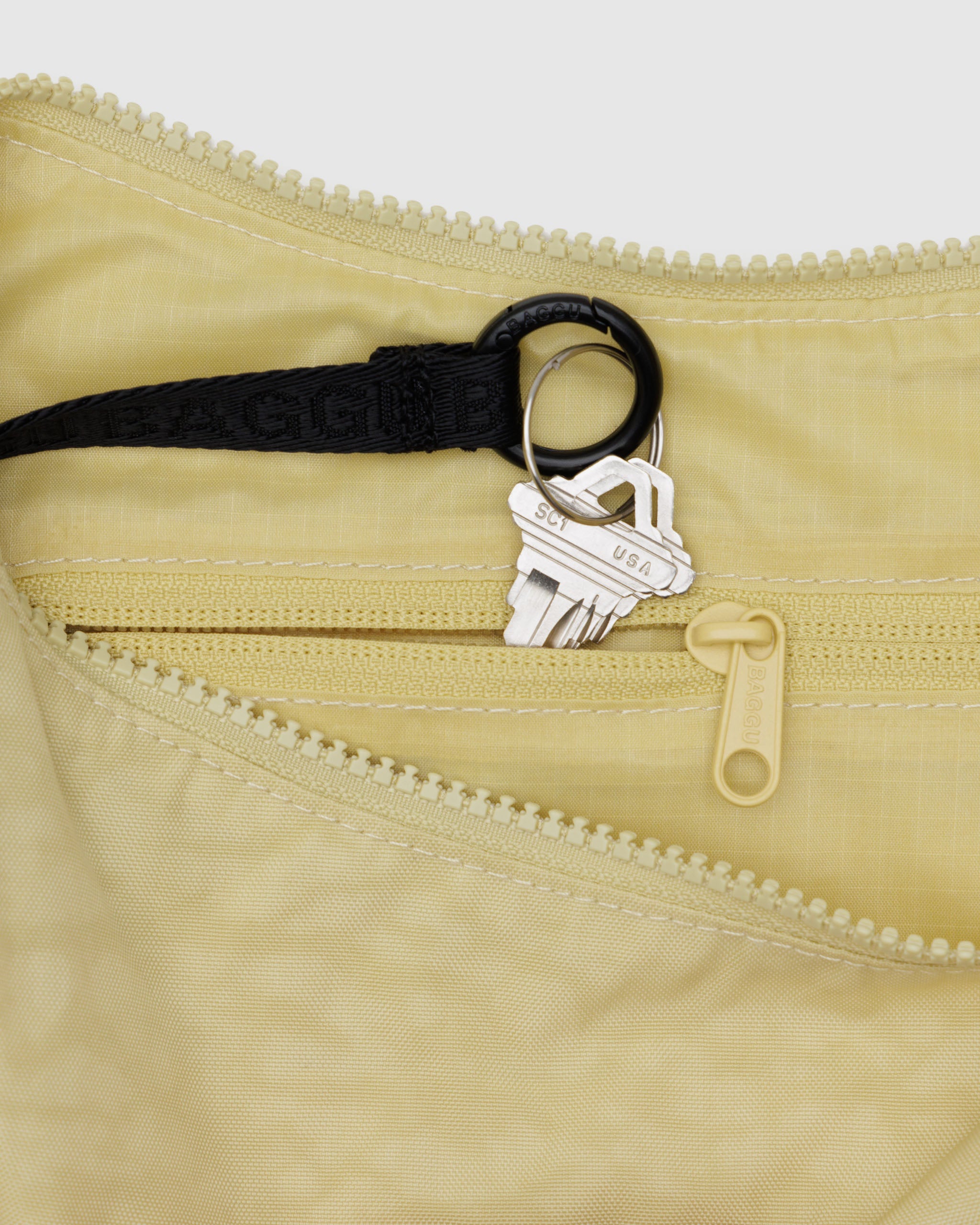 Butter Medium Nylon Crescent Bag | BAGGU | Crossbody Bag