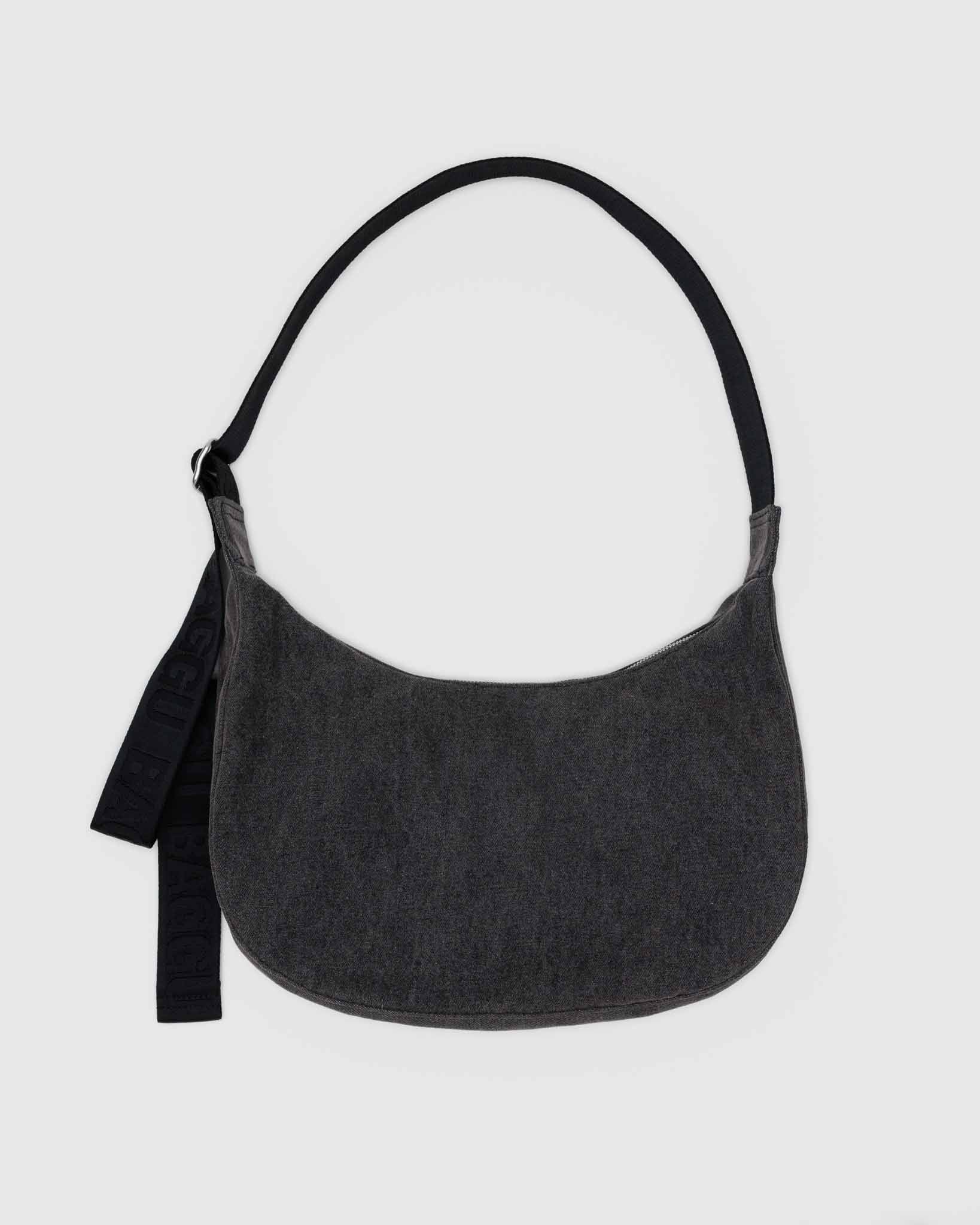 Gray BAGGU crescent shoulder bag with a black strap on a light gray background