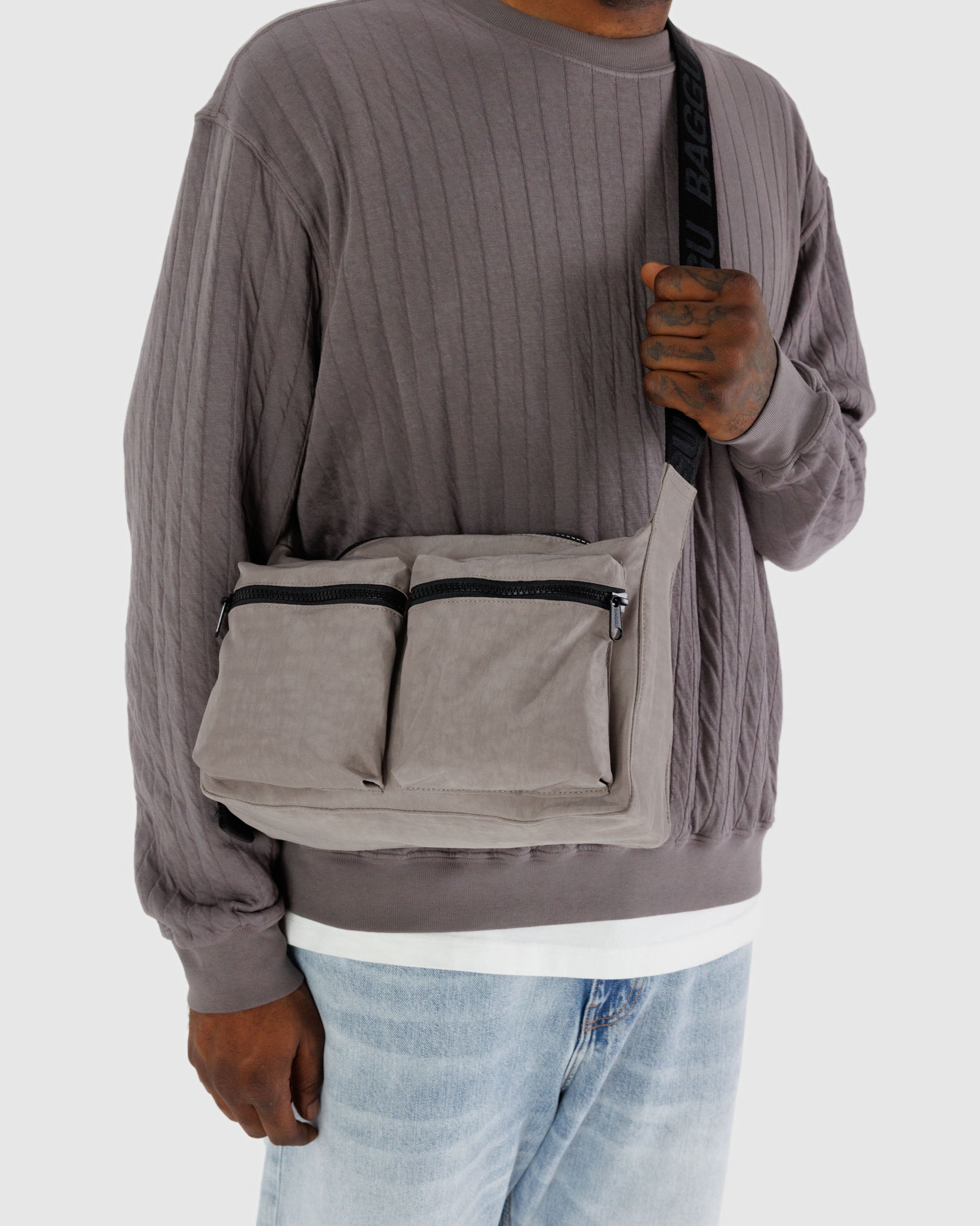 A Dove Medium Cargo Crossbody from BAGGU worn crossbody
