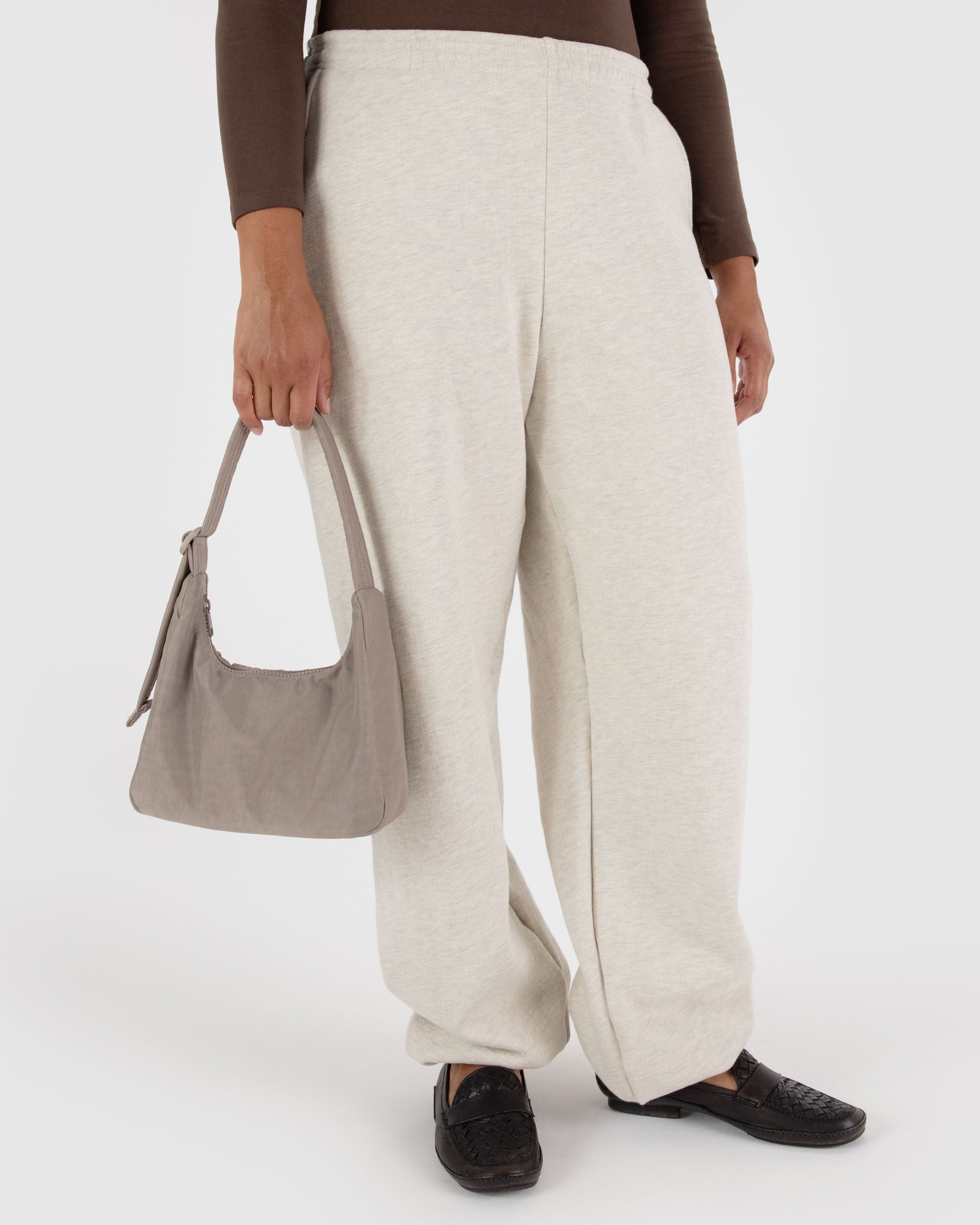 A close up of a BAGGU mini nylon shoulder bag in Dove. Made from recycled material. Machine washable 