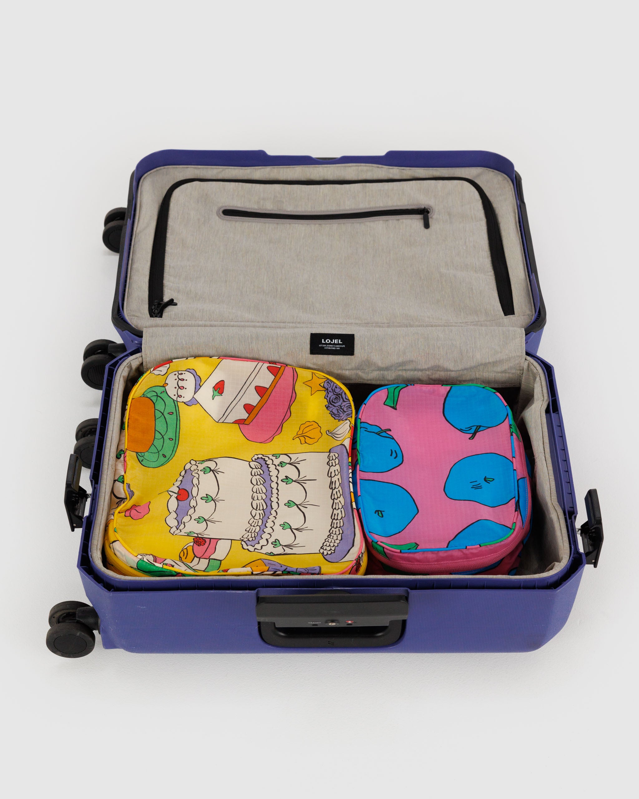 A set of BAGGU packing cubes in Still Life shown empty
