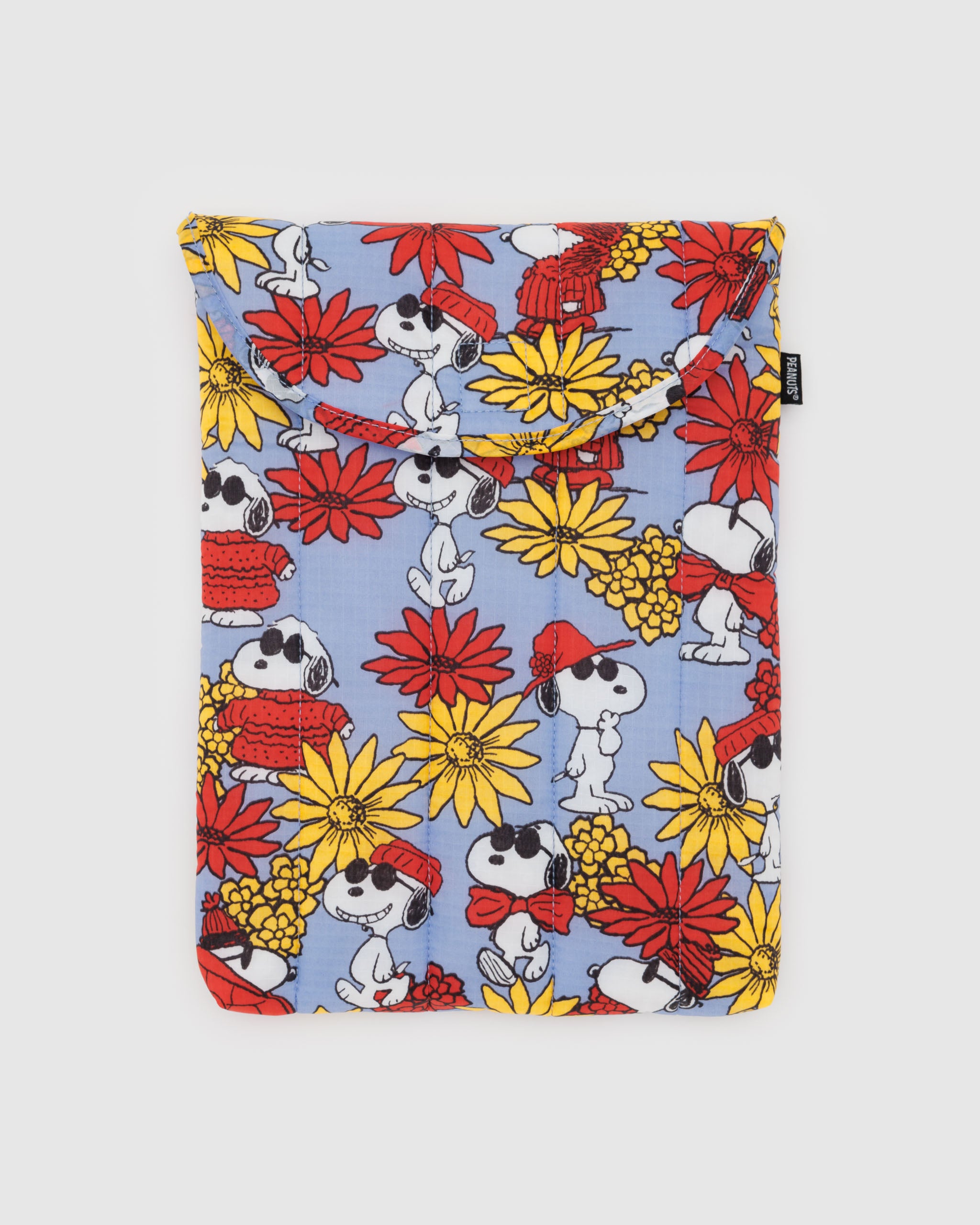 A BAGGU 13"/14" puffy laptop sleeve in Floral Snoopy