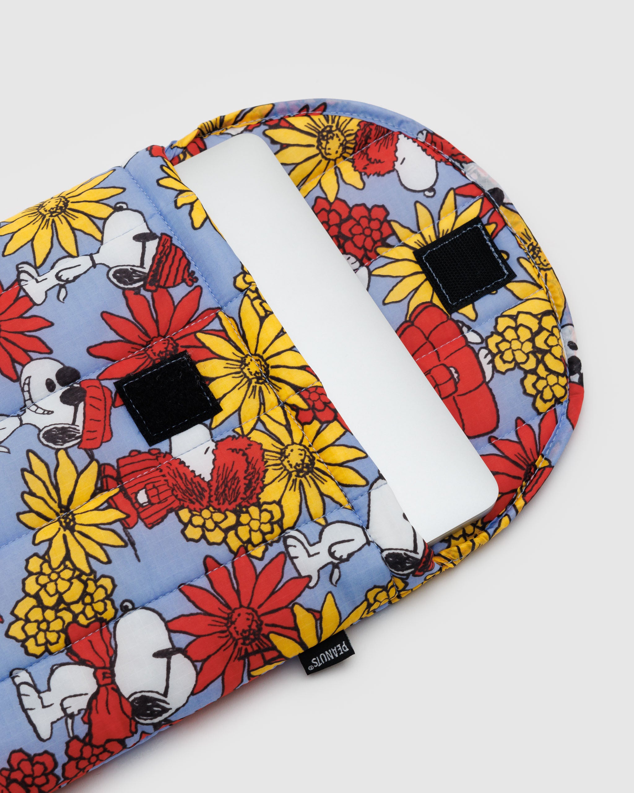 A BAGGU 13"/14" puffy laptop sleeve in Floral Snoopy A BAGGU 13"/14" puffy laptop sleeve in Floral Snoopy