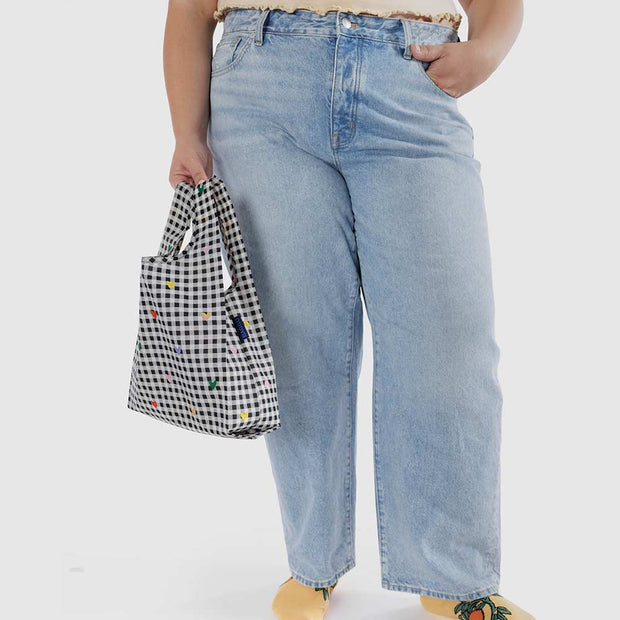 A person holding a Gingham Hearts design reusable Baby Baggu