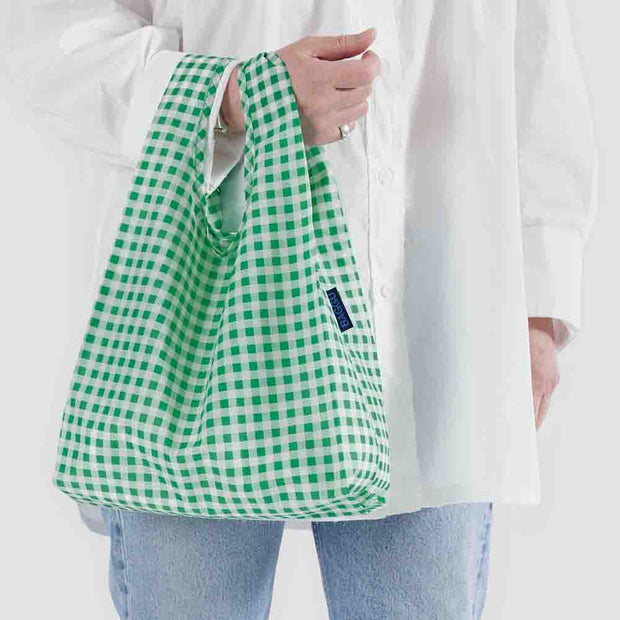 Person holding a Green Gingham Baby Baggu