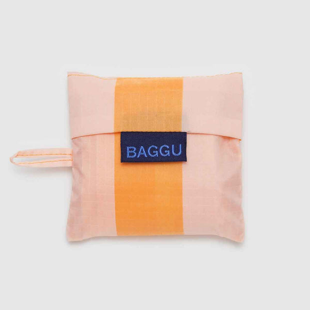 A Baby Baggu featuring the Tangerine Wide Stripe design in its pouch