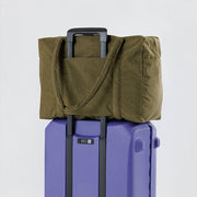 Seaweed Cloud Carry-on bag on suitcase