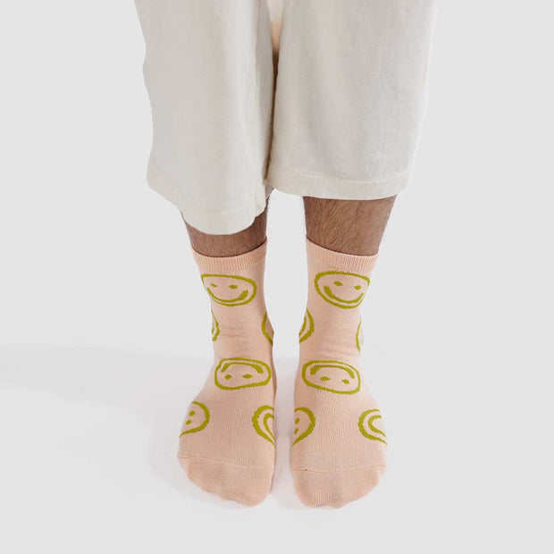 A person wearing A pair of Light Pink Happy Crew Socks