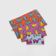 A BAGGU Keith Haring Pets Go Pouch set of three pouches laid flat