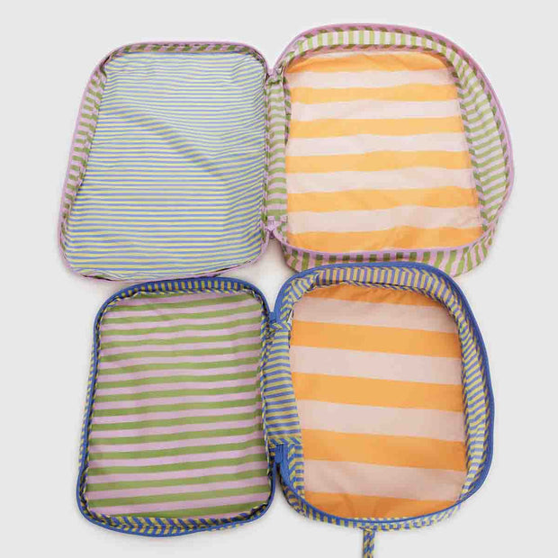 A set of two Baggu large packing cubes in the Hotel Stripe design shown empty