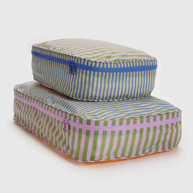 A set of two Baggu large packing cubes in the Hotel Stripe design shown stacked