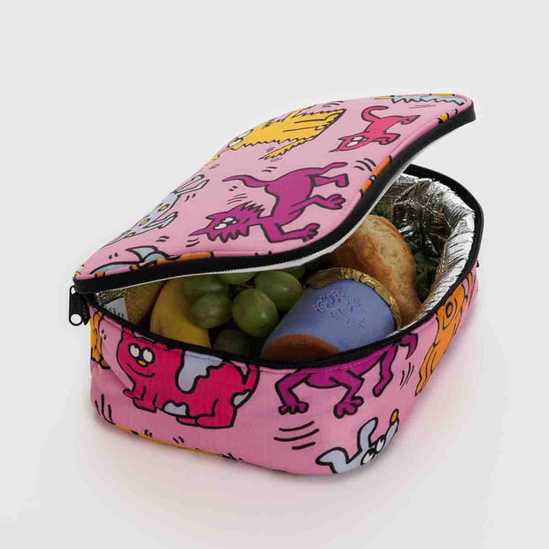An open BAGGU Keith Haring Pets lunch box/bag with lunch contents inside