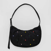 A medium Crescent Bag from Baggu in Embroidered Hearts