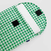 An open 13/14" Baggu Green Gingham puffy laptop sleeve containing a laptop