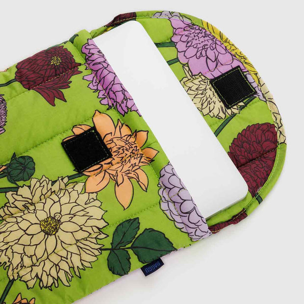 A 13"/14" Dahlia puffy laptop sleeve from BAGGU shown open with laptop inside