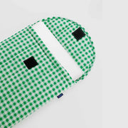 An open 16" Baggu Green Gingham puffy laptop sleeve containing a laptop