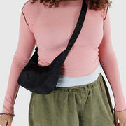 One small Crescent Bag from Baggu in Black worn crossbody