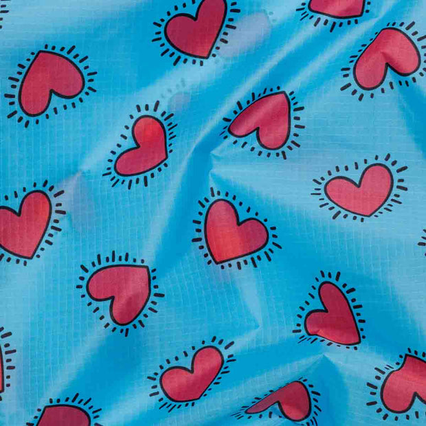 Close up of the Keith Haring Hearts Baggu desig