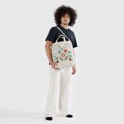 A person holding a  Baggu Embroidered Birds Zip Duck Bag 