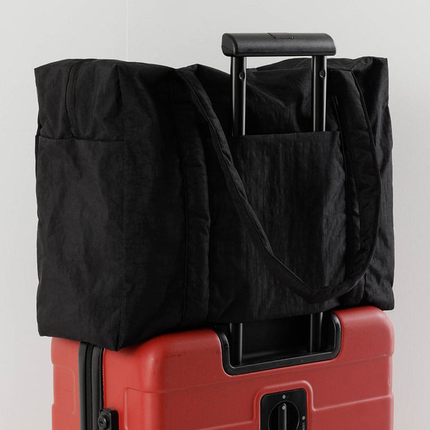 The black cloud carry-on with a slot to keep on your wheeled suitcase