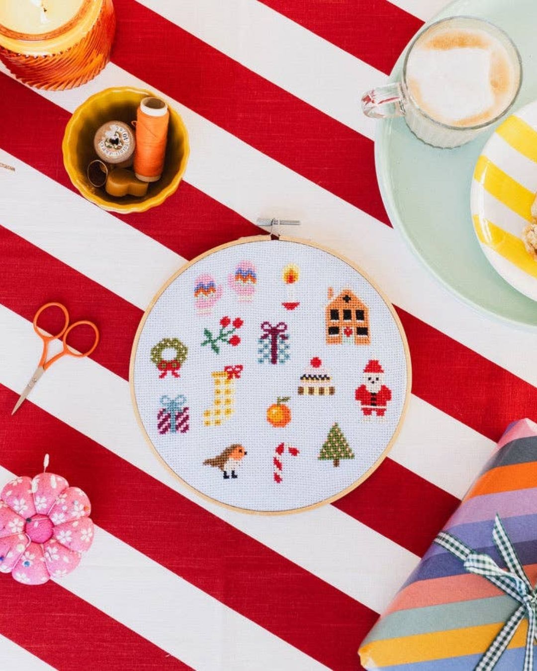 Cotton Clara Christmas-themed cross-stitch kit featuring festive colors and holiday design.