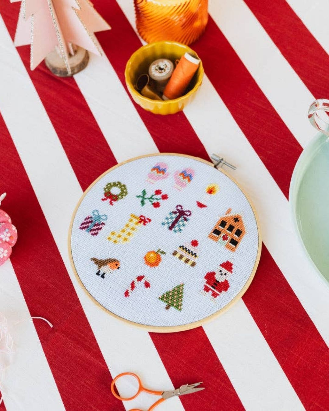 Cotton Clara Christmas-themed cross-stitch kit featuring festive colors and holiday design.
