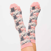 A pair of Miss Sparrow Happy Cat socks with over lapping pink and grey repeated cat pattern