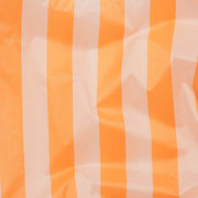 A close up of the Baggu Tangerine Wide Stripe standard reusable bag design