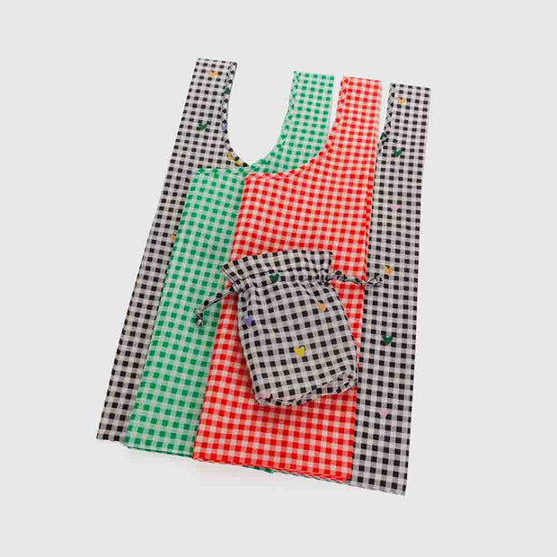 A set of 3 Standard Baggu recycled bags in Gingham designs, including the Gingham Hearts, Red Gingham and Green Gingham designs laid flat
