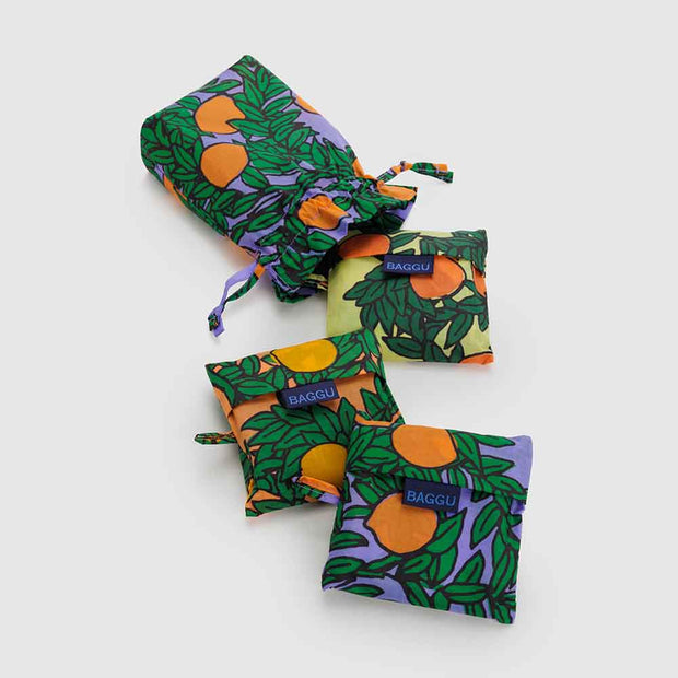 A set of 3 Standard Baggu recycled bags in the Orange Trees designs, including the Periwinkle, Yellow and Coral designs