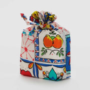 A set of 3 Standard Baggu recycled bags in the Vacation Tiles designs, including the Cherry Tile, Navy Stripe and Sunshine Tile designs in a drawstring pouch