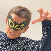 Boy wearing bat mask 